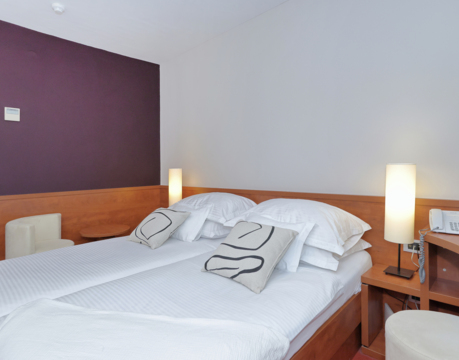 hotel room with double bed and bedside tables