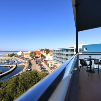 Balcony view overlooking the marina and seaside town